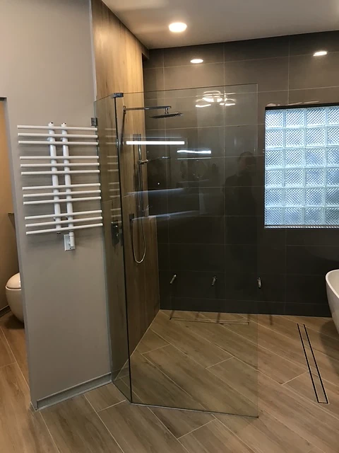 Bathroom renovation — dark tile shower